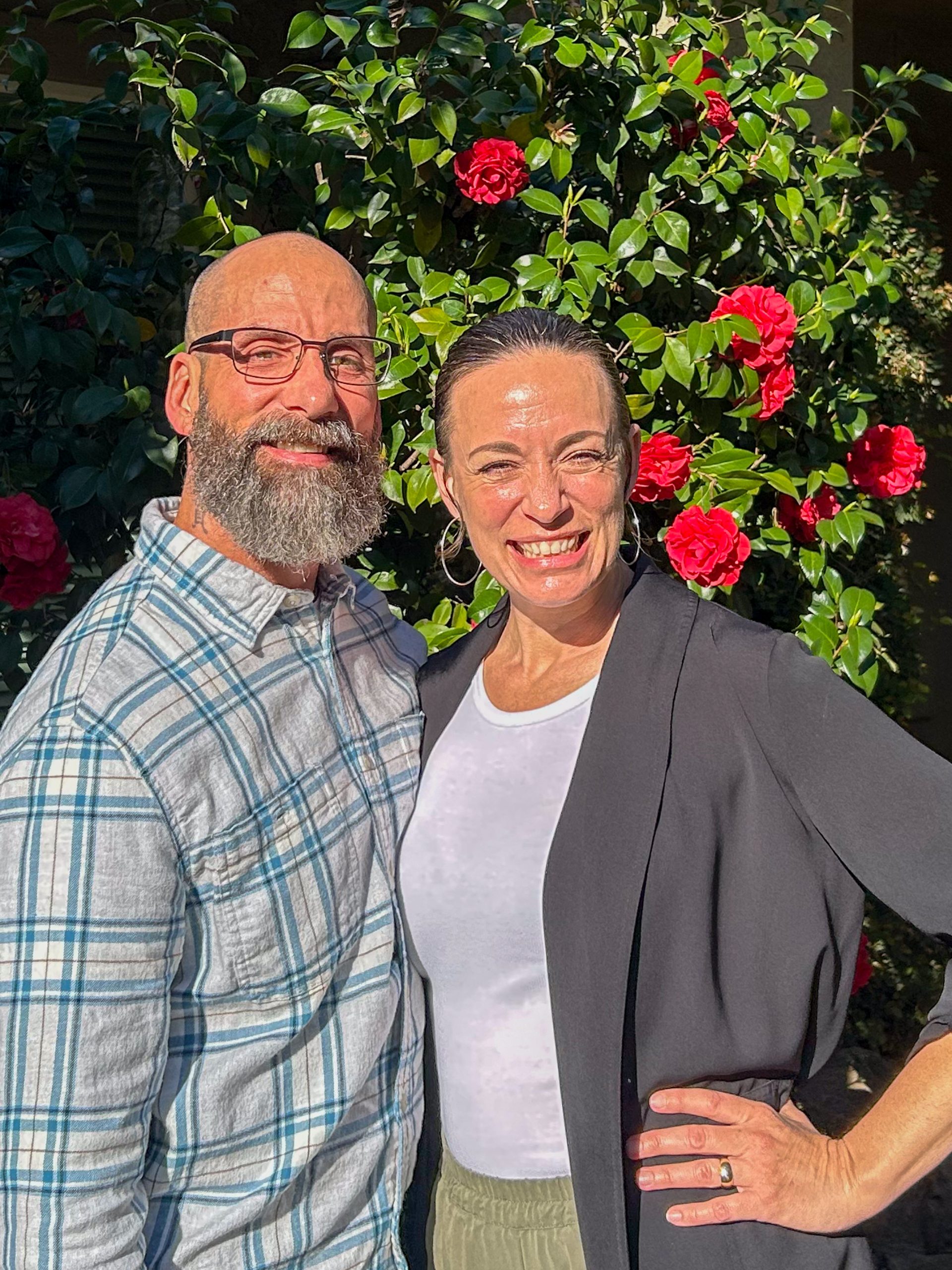 team in front of a nice plant
